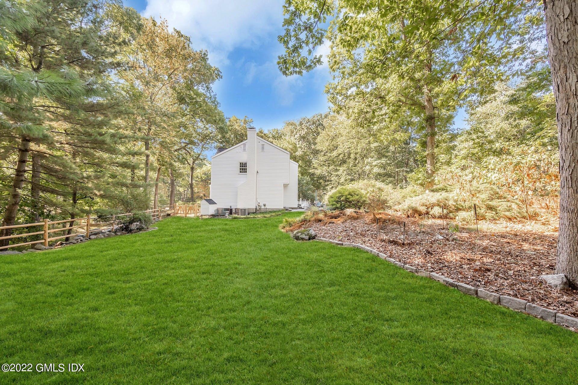 12 Frontier Road Cos Cob, CT 06807 - Photo 30 of 36 a view of a backyard with large trees