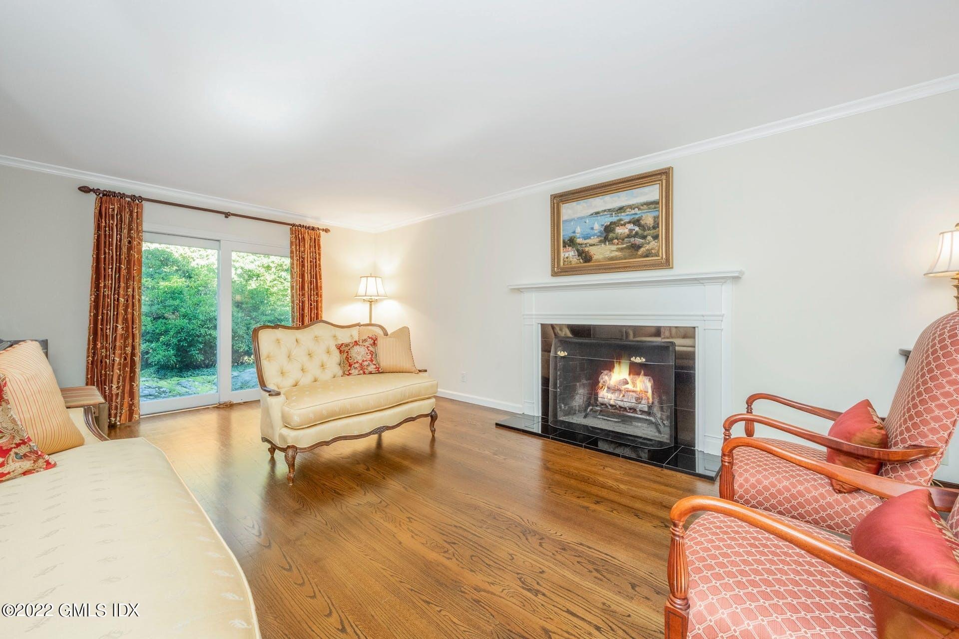 12 Frontier Road Cos Cob, CT 06807 - Photo 9 of 36 a living room with furniture and a fireplace