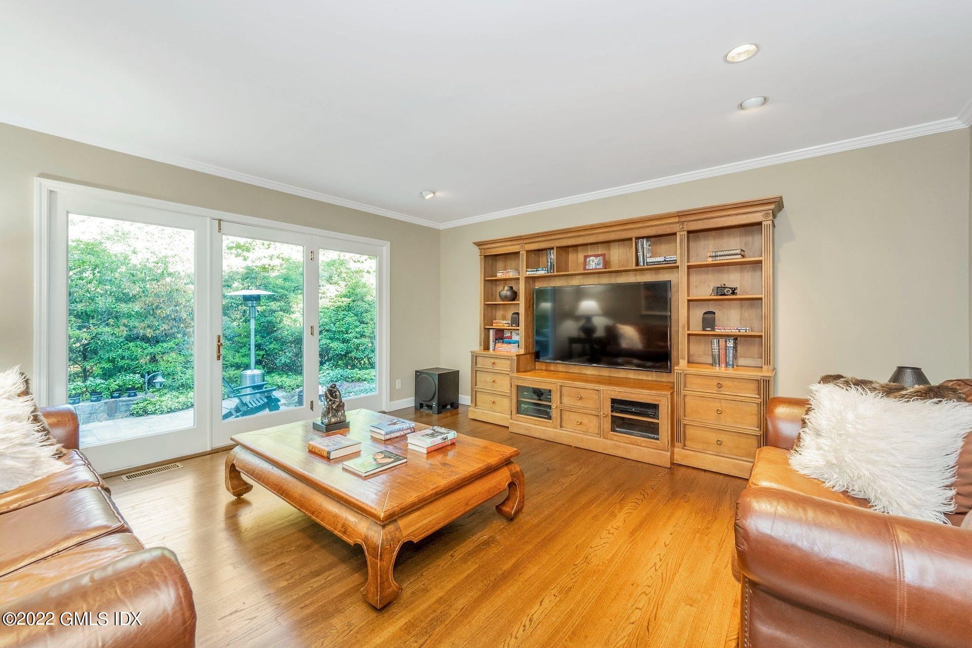 12 Frontier Road Cos Cob, CT 06807 - Photo 10 of 36 a living room with furniture and a flat screen tv