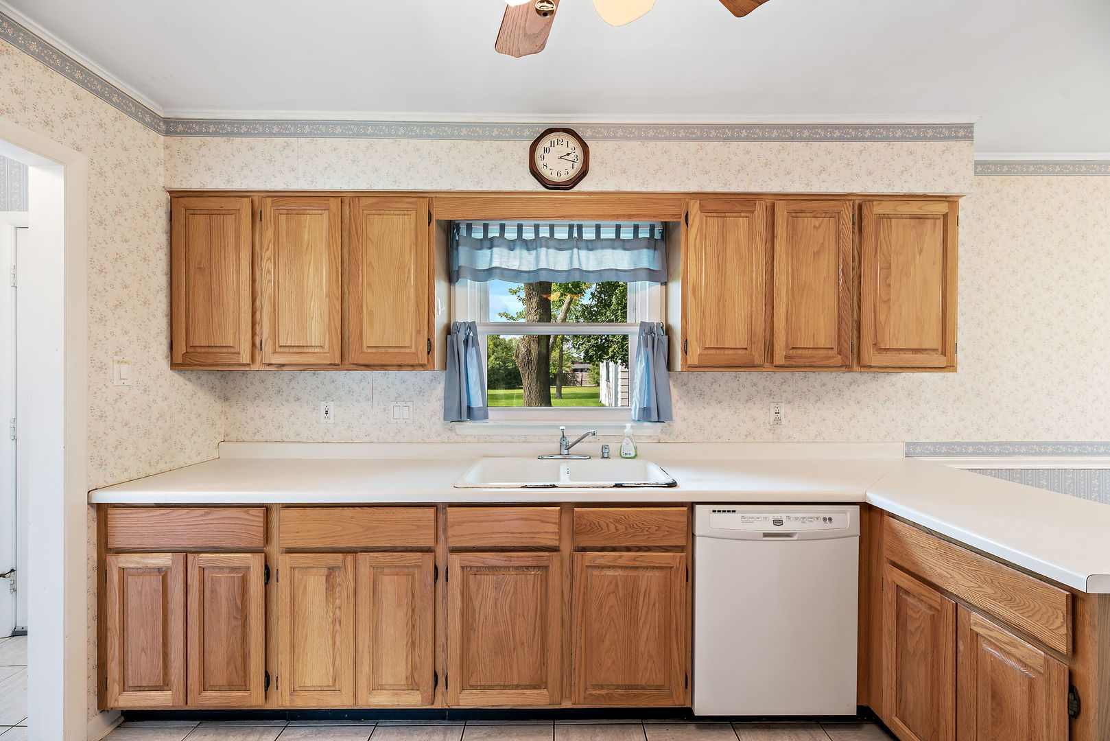 28 Chestnut Road Northbrook, IL 60062 - Photo 6 of 25 a kitchen with a sink cabinets and window