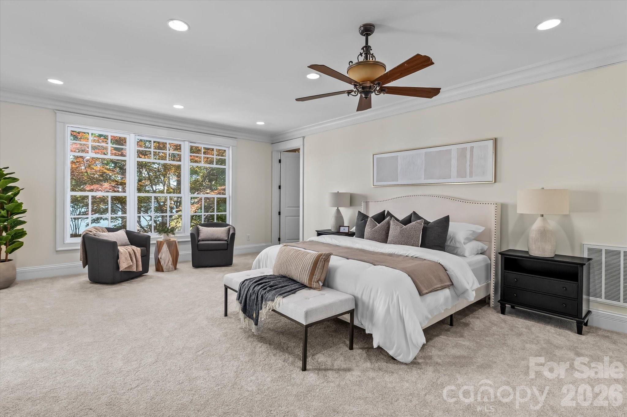 17821 Carlow Road Cornelius, NC 28031 - Photo 14 of 45 a spacious bedroom with a bed and glass window