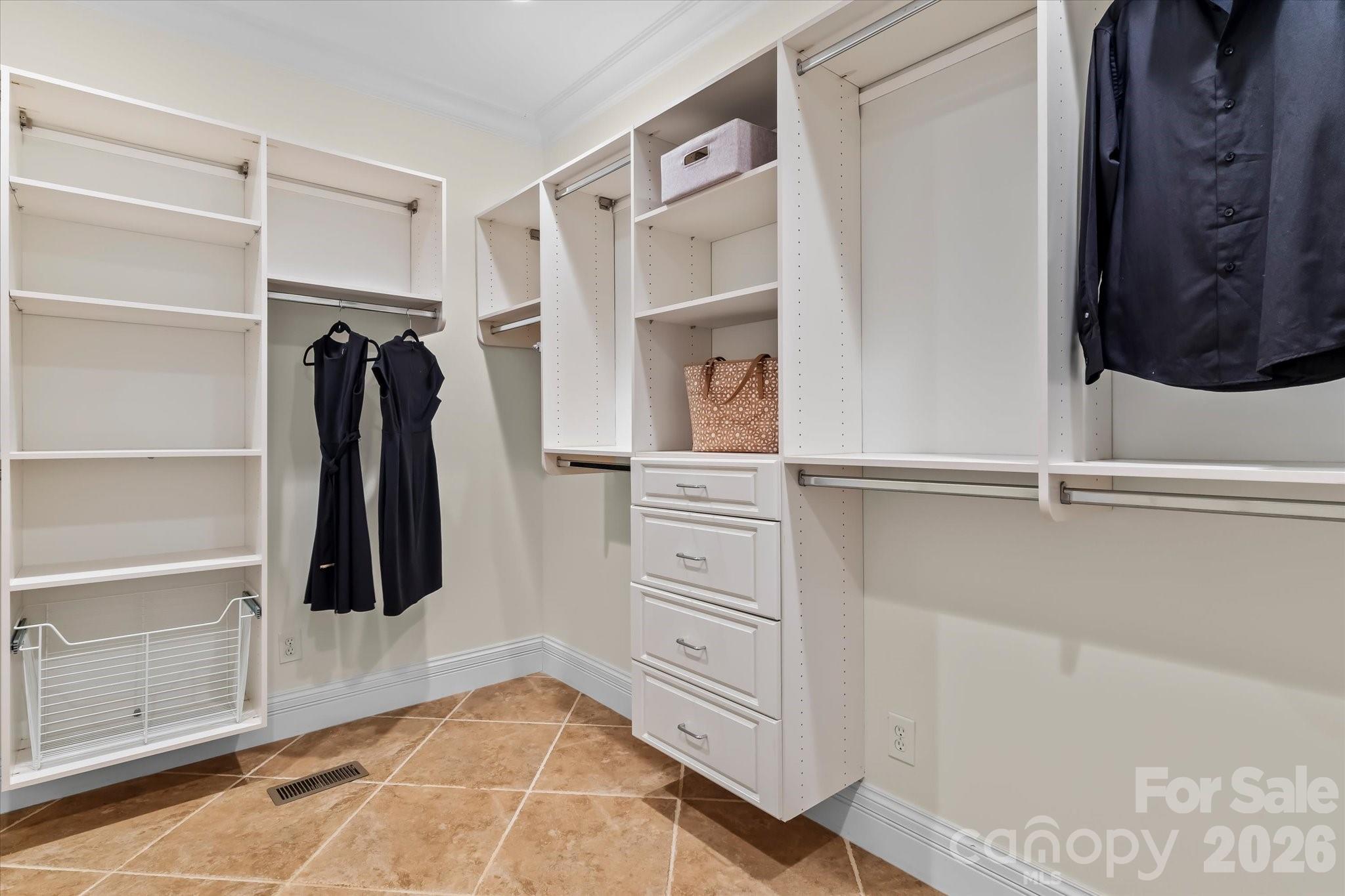 17821 Carlow Road Cornelius, NC 28031 - Photo 18 of 45 a view of walk in closet with clothes and shoes