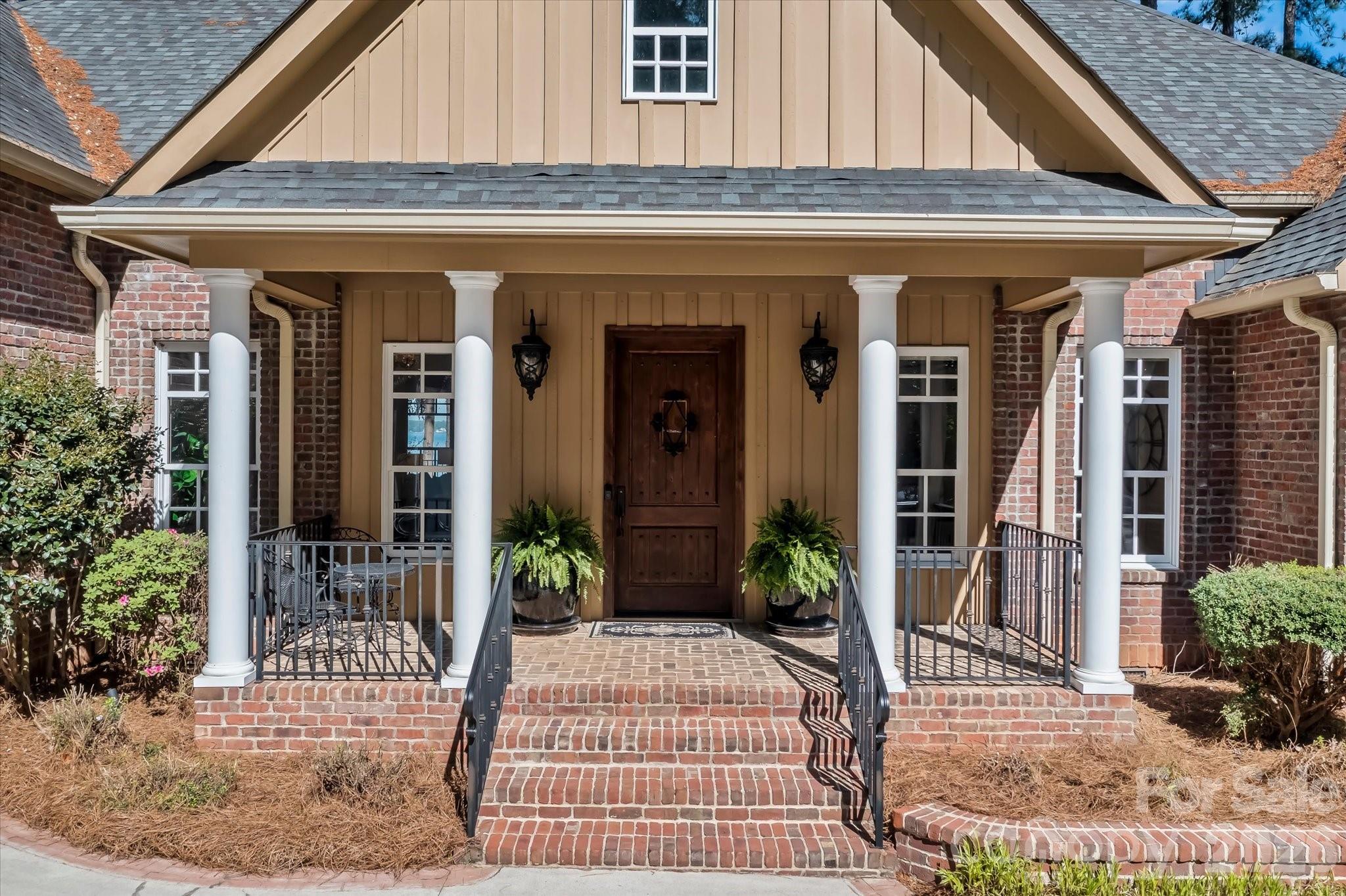 17821 Carlow Road Cornelius, NC 28031 - Photo 2 of 45 a view of a house with a potted plant and floor to ceiling window and potted plants