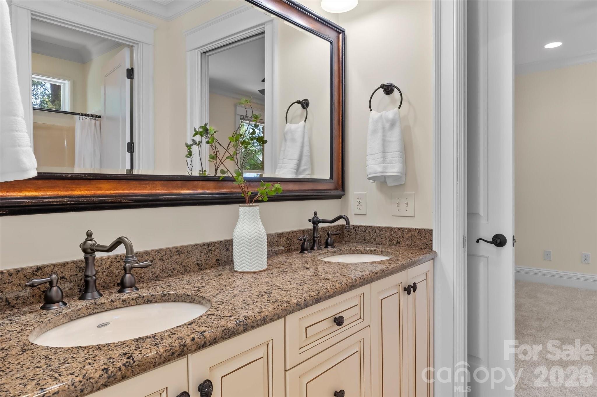17821 Carlow Road Cornelius, NC 28031 - Photo 21 of 45 a bathroom with double sink and a mirror