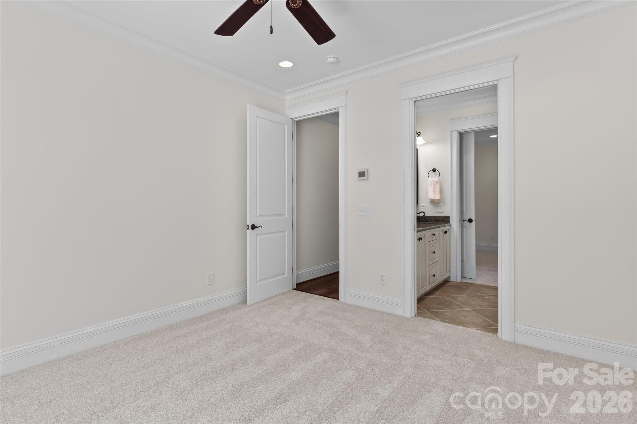 17821 Carlow Road Cornelius, NC 28031 - Photo 23 of 45 an empty room with closet and fan