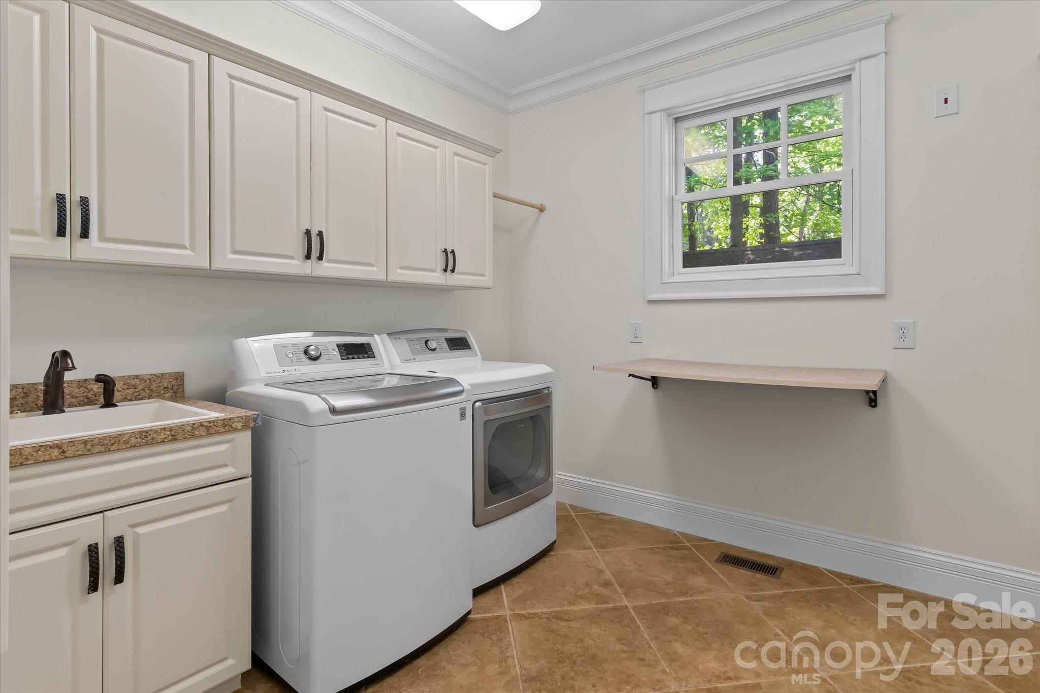 17821 Carlow Road Cornelius, NC 28031 - Photo 27 of 45 a utility room with sink dryer and washer