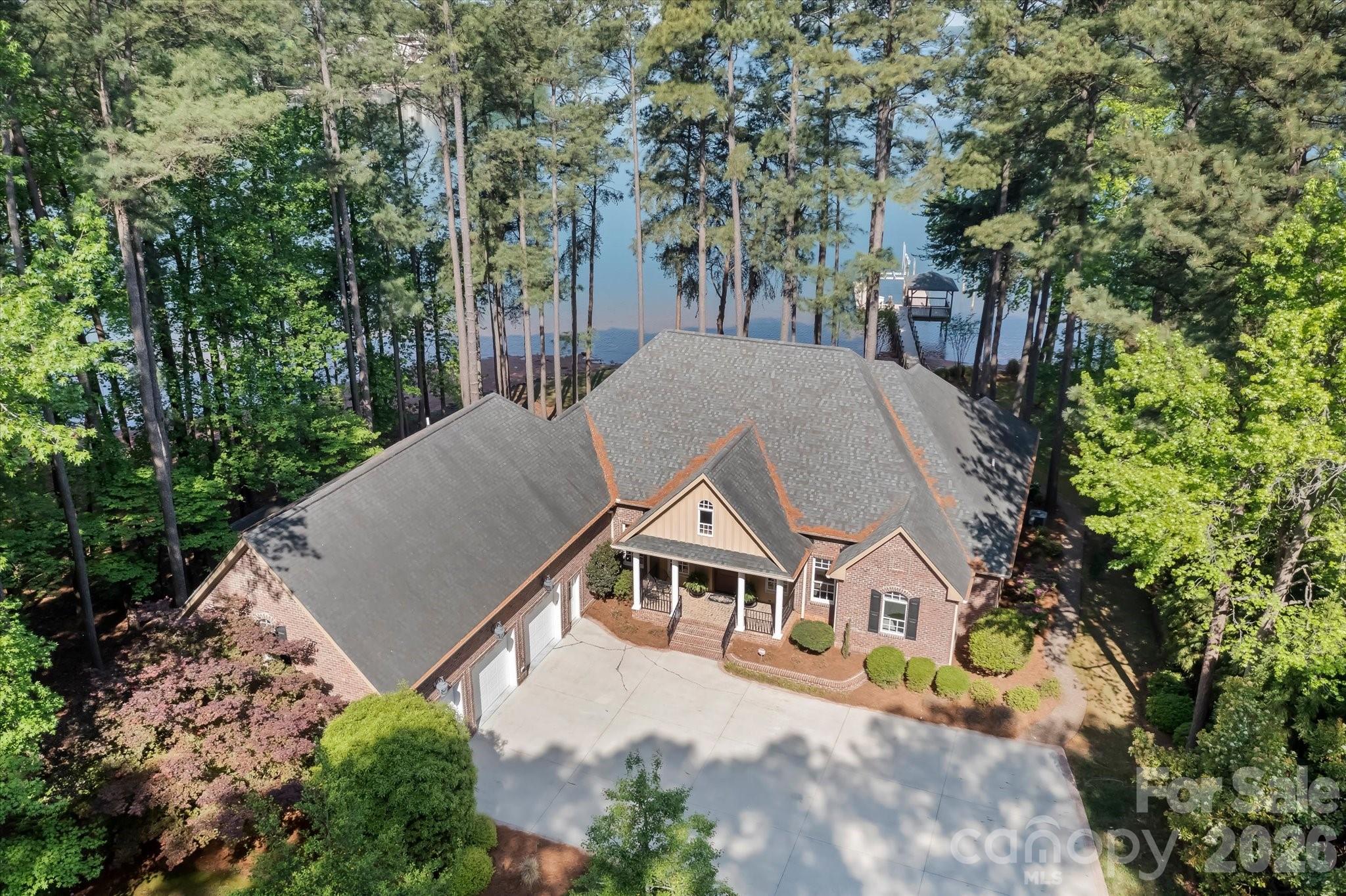 17821 Carlow Road Cornelius, NC 28031 - Photo 39 of 45 an aerial view of a house with yard and trees in the background