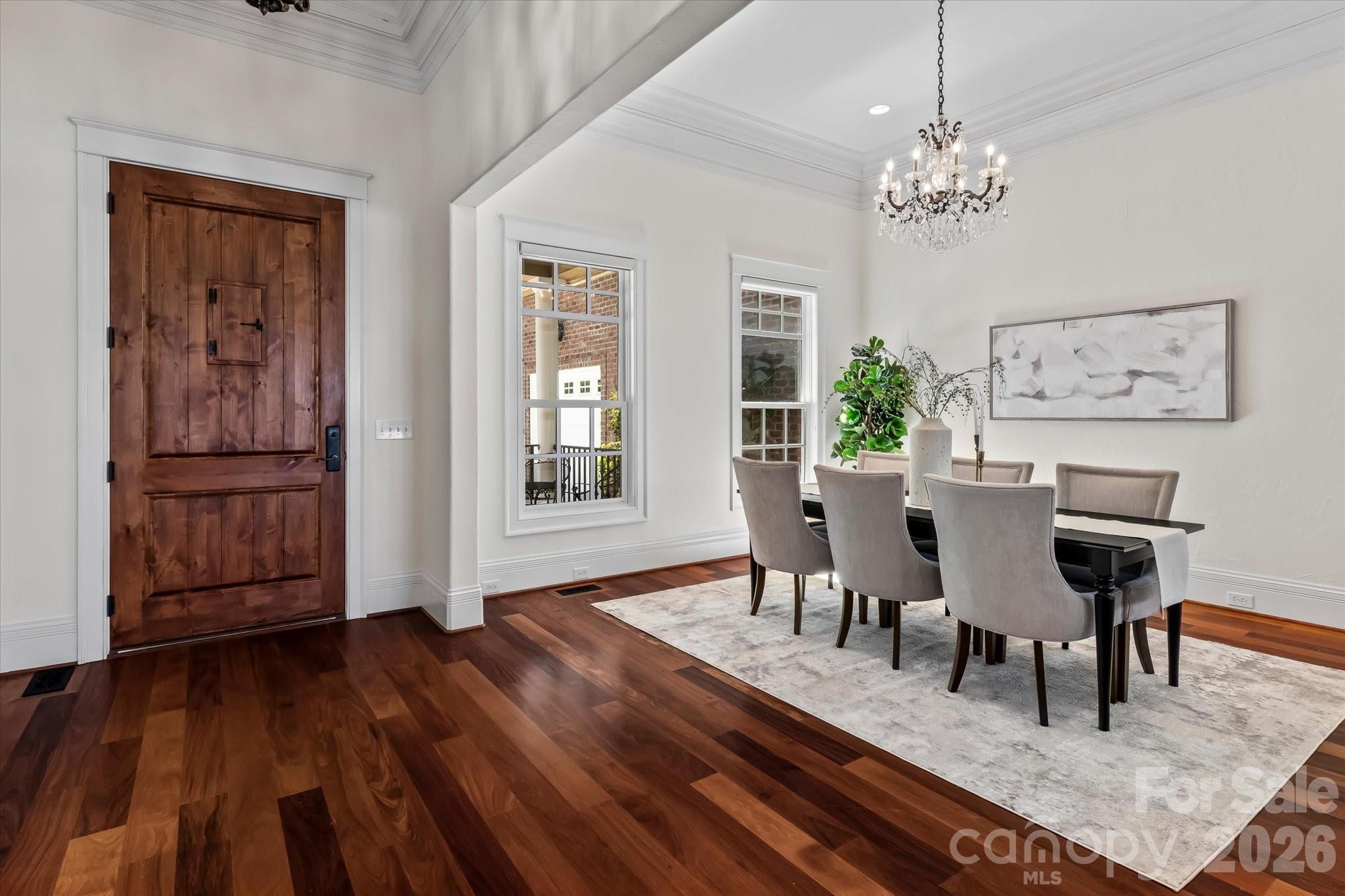 17821 Carlow Road Cornelius, NC 28031 - Photo 4 of 45 a view of a dining room with furniture and wooden floor
