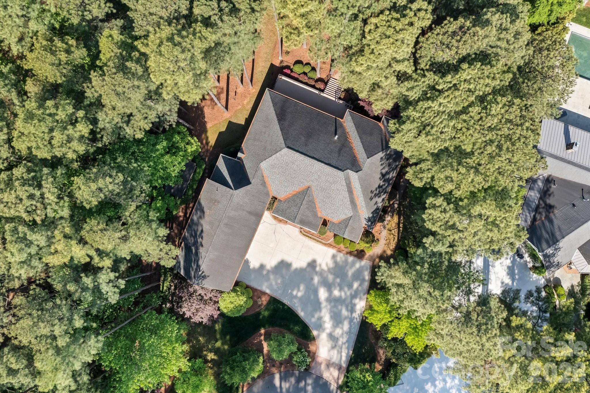 17821 Carlow Road Cornelius, NC 28031 - Photo 41 of 45 an aerial view of a house with a yard and plants