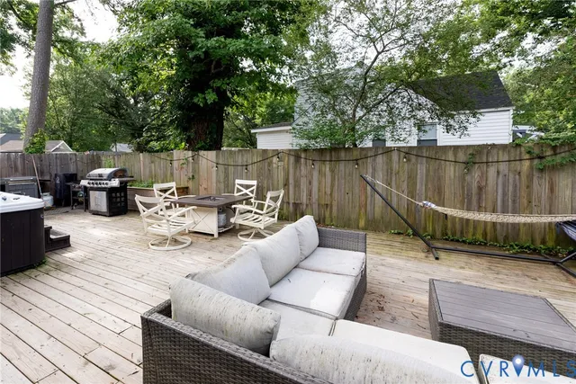 a view of a terrace with couches and a table and chairs