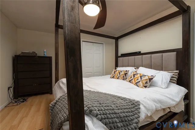 a bedroom with a bed and a dresser