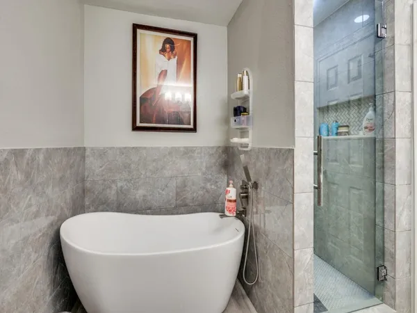 a white bath tub sitting in a bathroom