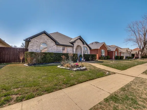 a front view of house with yard and outdoor seating