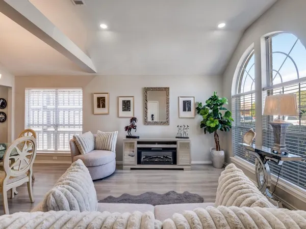 a living room with furniture and a large window