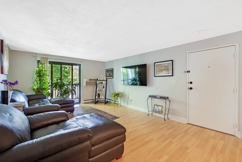 14 Walker Road, Unit 6 North Andover, MA 01845 - Photo 11 of 21 a living room with furniture and a window