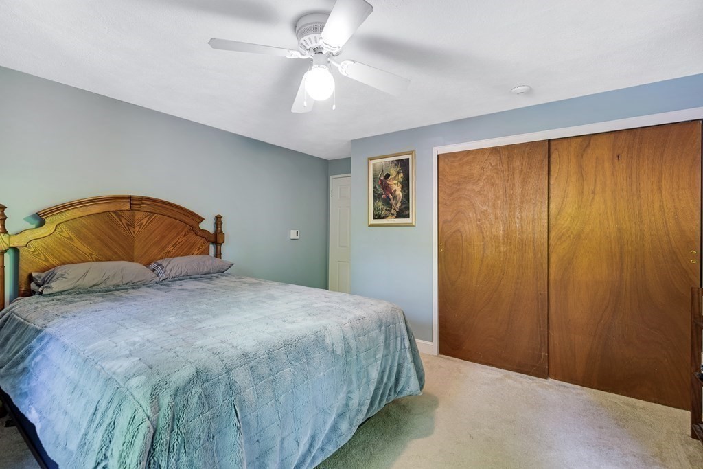 14 Walker Road, Unit 6 North Andover, MA 01845 - Photo 12 of 21 a bedroom with a bed and a painting on the wall