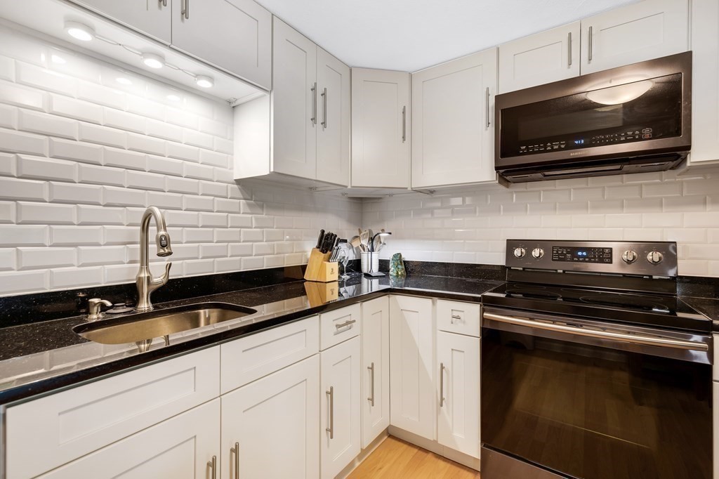 14 Walker Road, Unit 6 North Andover, MA 01845 - Photo 6 of 21 a kitchen with a sink and cabinets
