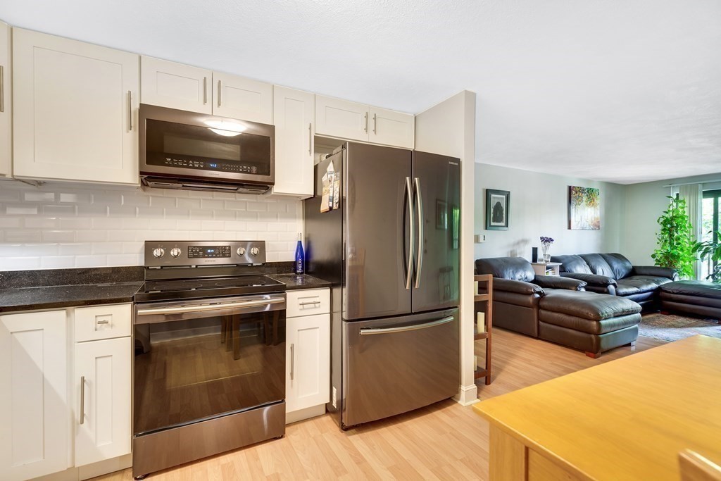 14 Walker Road, Unit 6 North Andover, MA 01845 - Photo 8 of 21 a kitchen with a refrigerator stove and microwave
