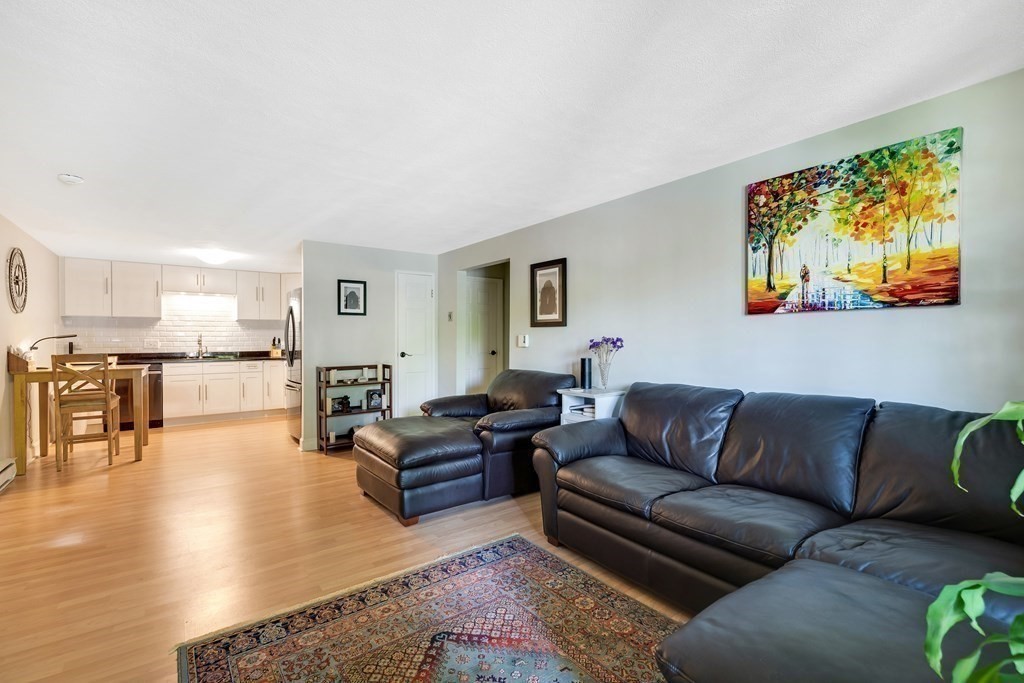14 Walker Road, Unit 6 North Andover, MA 01845 - Photo 9 of 21 a living room with furniture and kitchen view