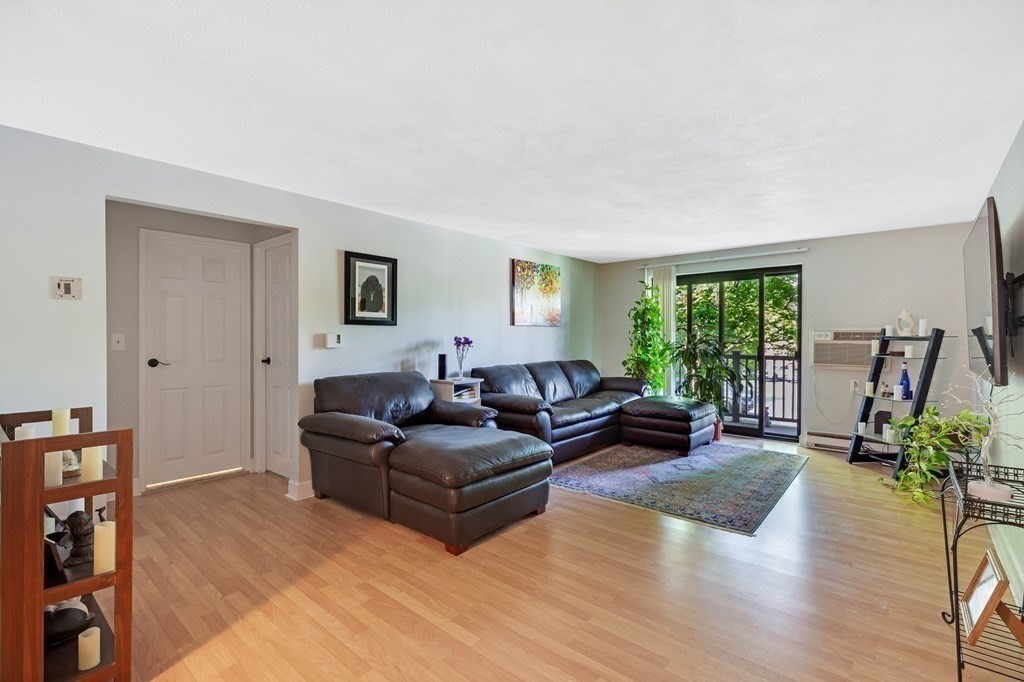 14 Walker Road, Unit 6 North Andover, MA 01845 - Photo 10 of 21 a living room with furniture and a wooden floor