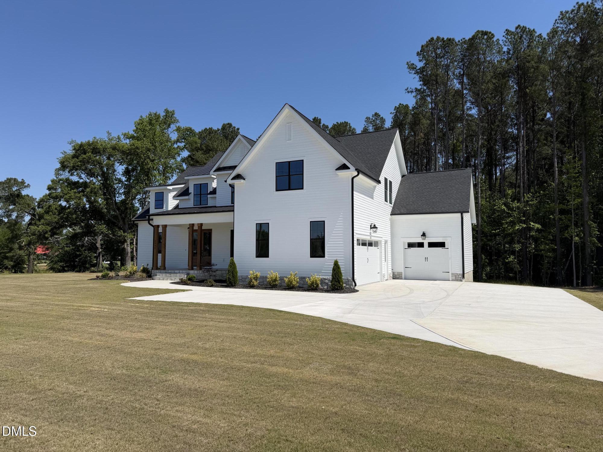 2590 Lassiter Road Four Oaks, NC 27524 - Photo 55 of 72 a front view of a house with a yard