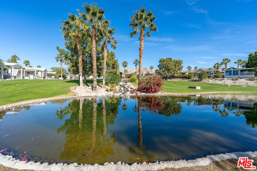 70200 Dillon Road, Unit 581 Desert Hot Springs, CA 92241 - Photo 17 of 23 a view of a lake with houses