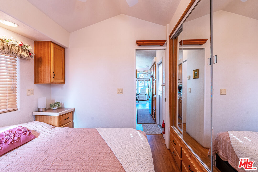 70200 Dillon Road, Unit 581 Desert Hot Springs, CA 92241 - Photo 20 of 23 a bedroom with a bed and a window