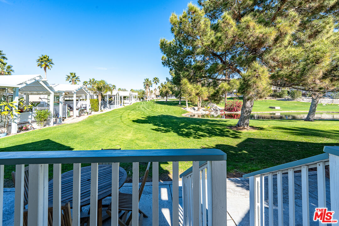 70200 Dillon Road, Unit 581 Desert Hot Springs, CA 92241 - Photo 21 of 23 a view of a porch and garden