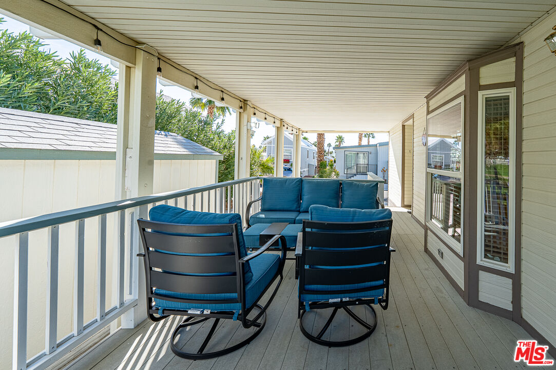70200 Dillon Road, Unit 581 Desert Hot Springs, CA 92241 - Photo 3 of 23 a building outdoor space with seating