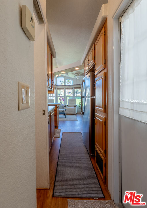 70200 Dillon Road, Unit 581 Desert Hot Springs, CA 92241 - Photo 4 of 23 a hallway with sitting area