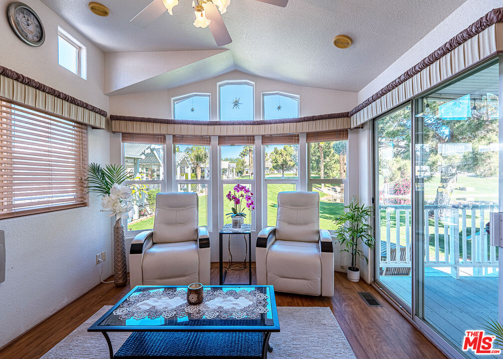 70200 Dillon Road, Unit 581 Desert Hot Springs, CA 92241 - Photo 7 of 23 a living room with furniture and a potted plant