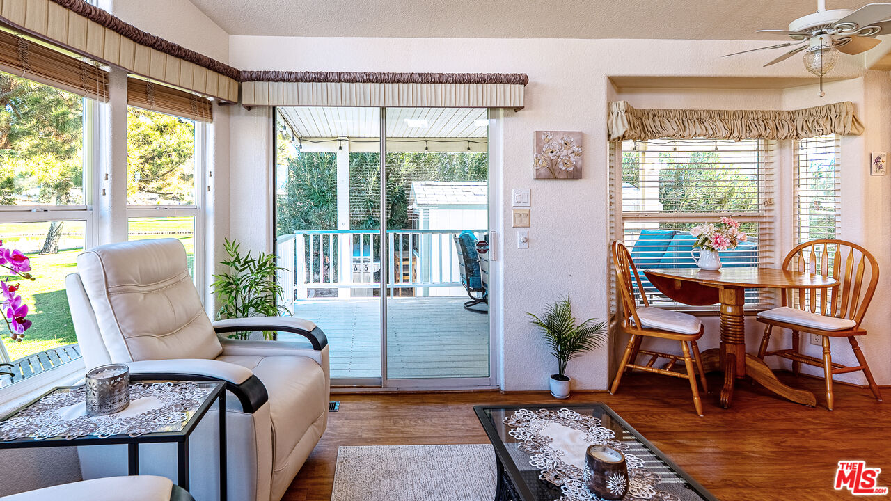 70200 Dillon Road, Unit 581 Desert Hot Springs, CA 92241 - Photo 8 of 23 a living room with furniture and a window