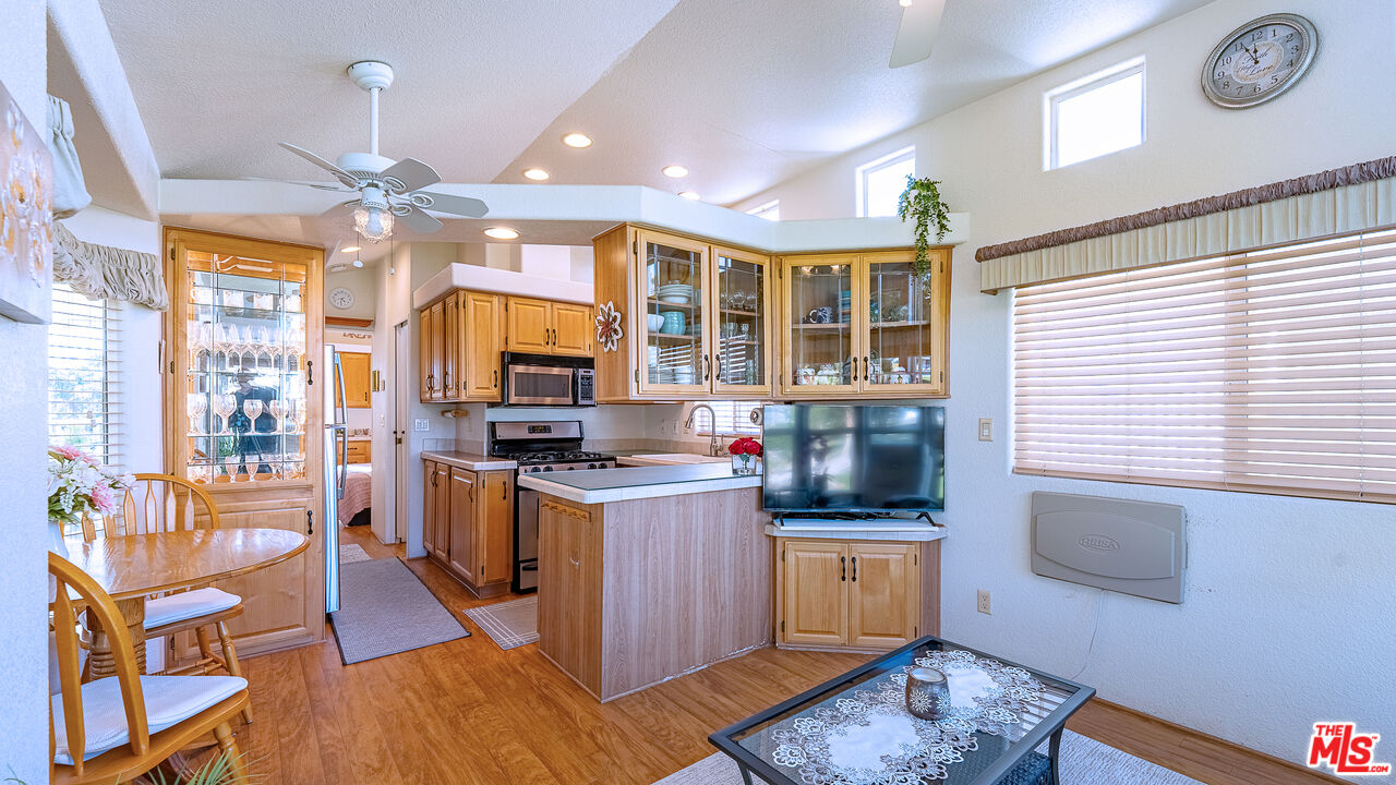 70200 Dillon Road, Unit 581 Desert Hot Springs, CA 92241 - Photo 9 of 23 a kitchen with sink stove and refrigerator