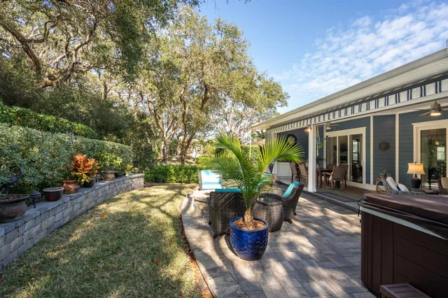 a bed room with furniture and a flat screen tv