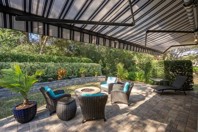 a view of a hallway with seating area