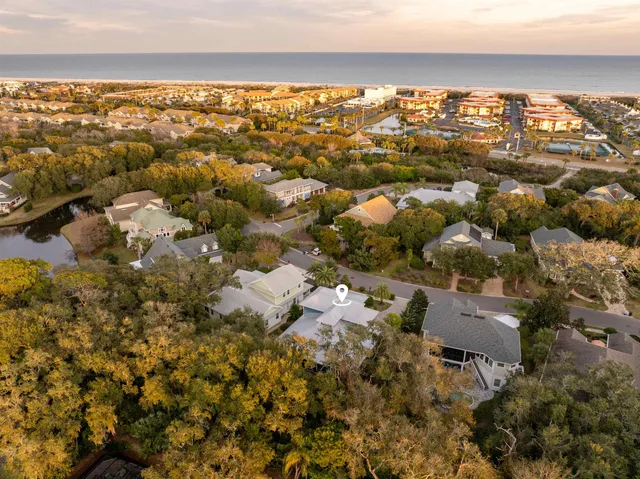 a view of an entryway with wooden floor and windows