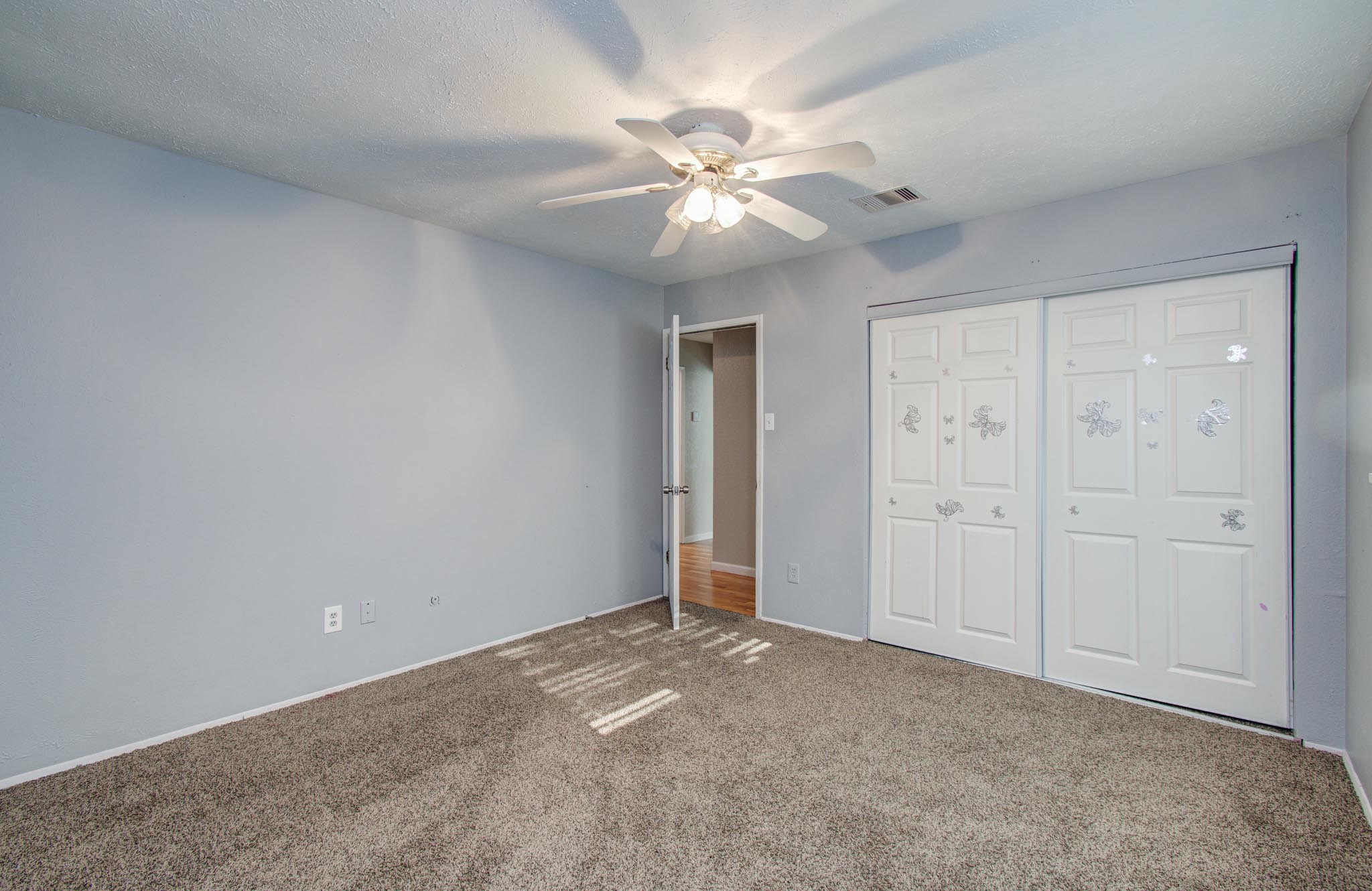 5706 Spring Grove Lane Spring, TX 77373 - Photo 7 of 12 a view of an empty room with a fan