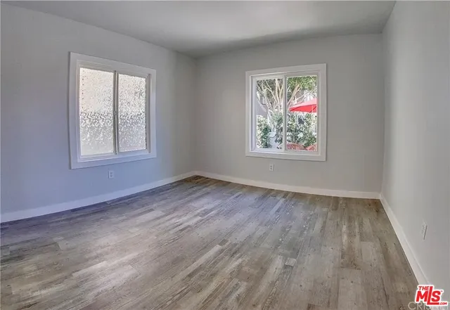 a kitchen with stainless steel appliances granite countertop a refrigerator sink and stove