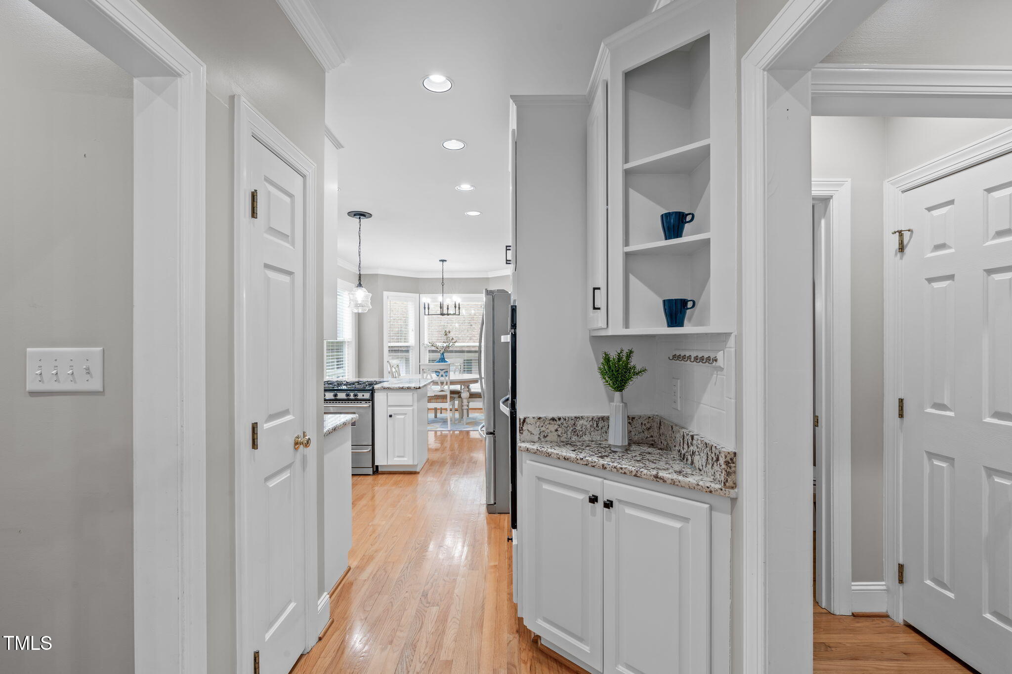 6016 Heatherstone Drive Raleigh, NC 27606 - Photo 15 of 40 a kitchen with stainless steel appliances granite countertop a refrigerator and a stove top oven