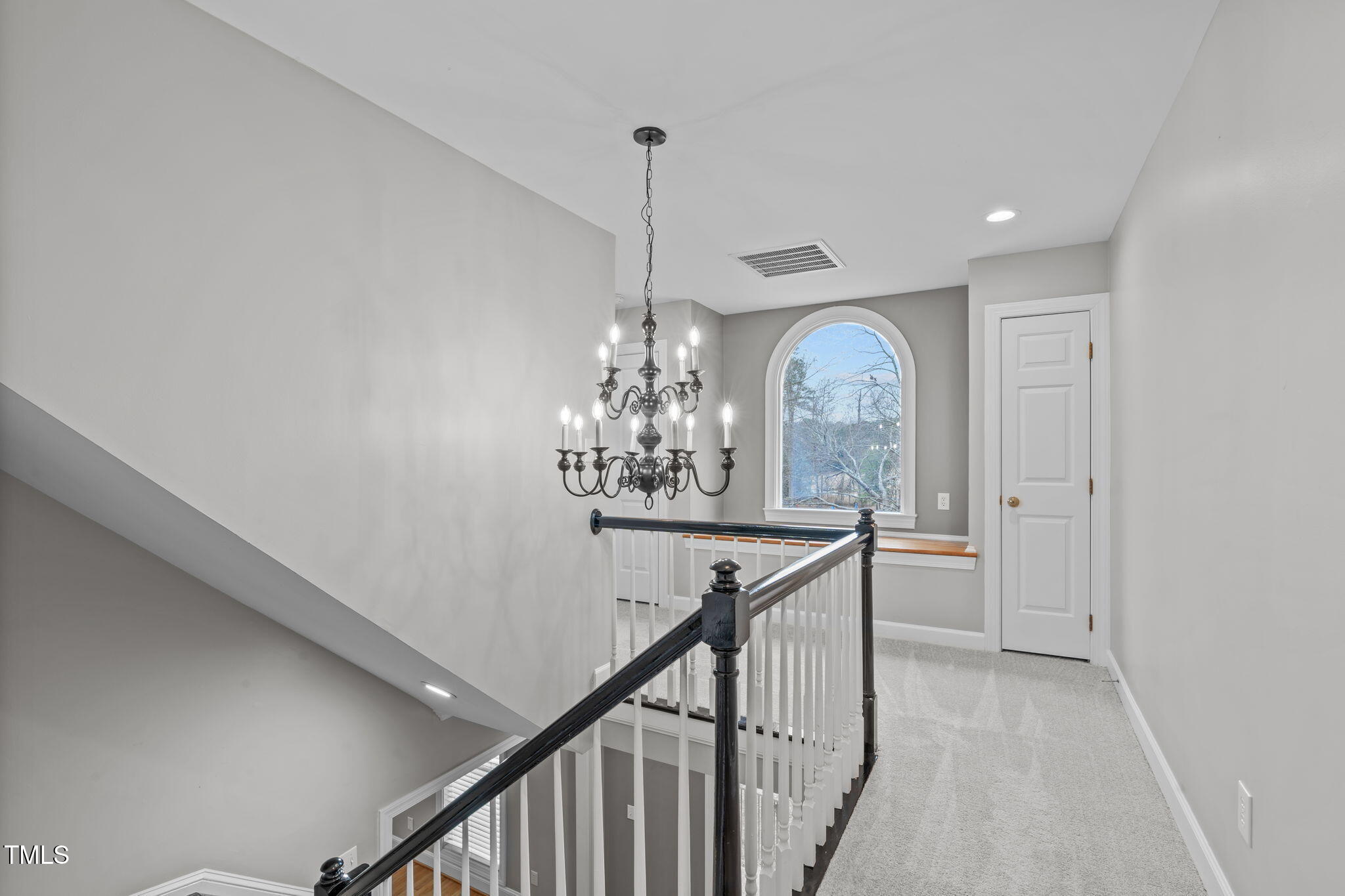 6016 Heatherstone Drive Raleigh, NC 27606 - Photo 17 of 40 a view of a chandelier in a room