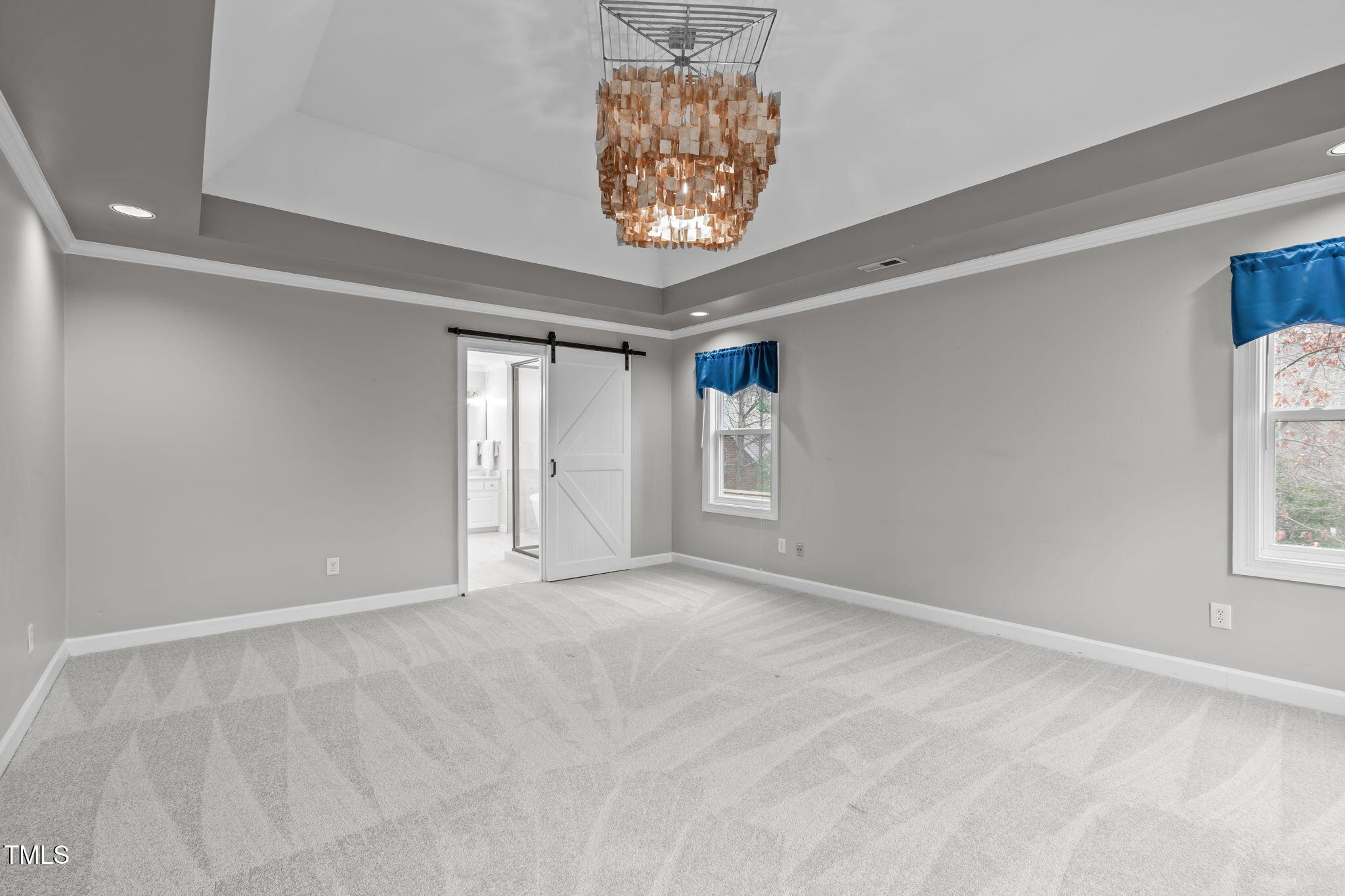 6016 Heatherstone Drive Raleigh, NC 27606 - Photo 19 of 40 a view of an empty room with a window