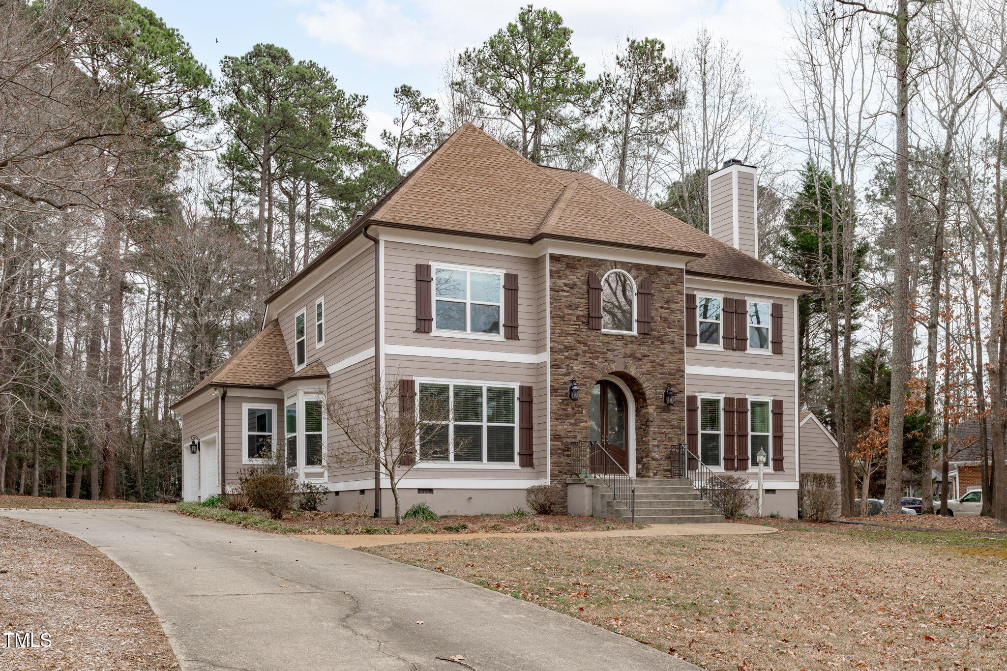 6016 Heatherstone Drive Raleigh, NC 27606 - Photo 2 of 40 a front view of a house with a yard