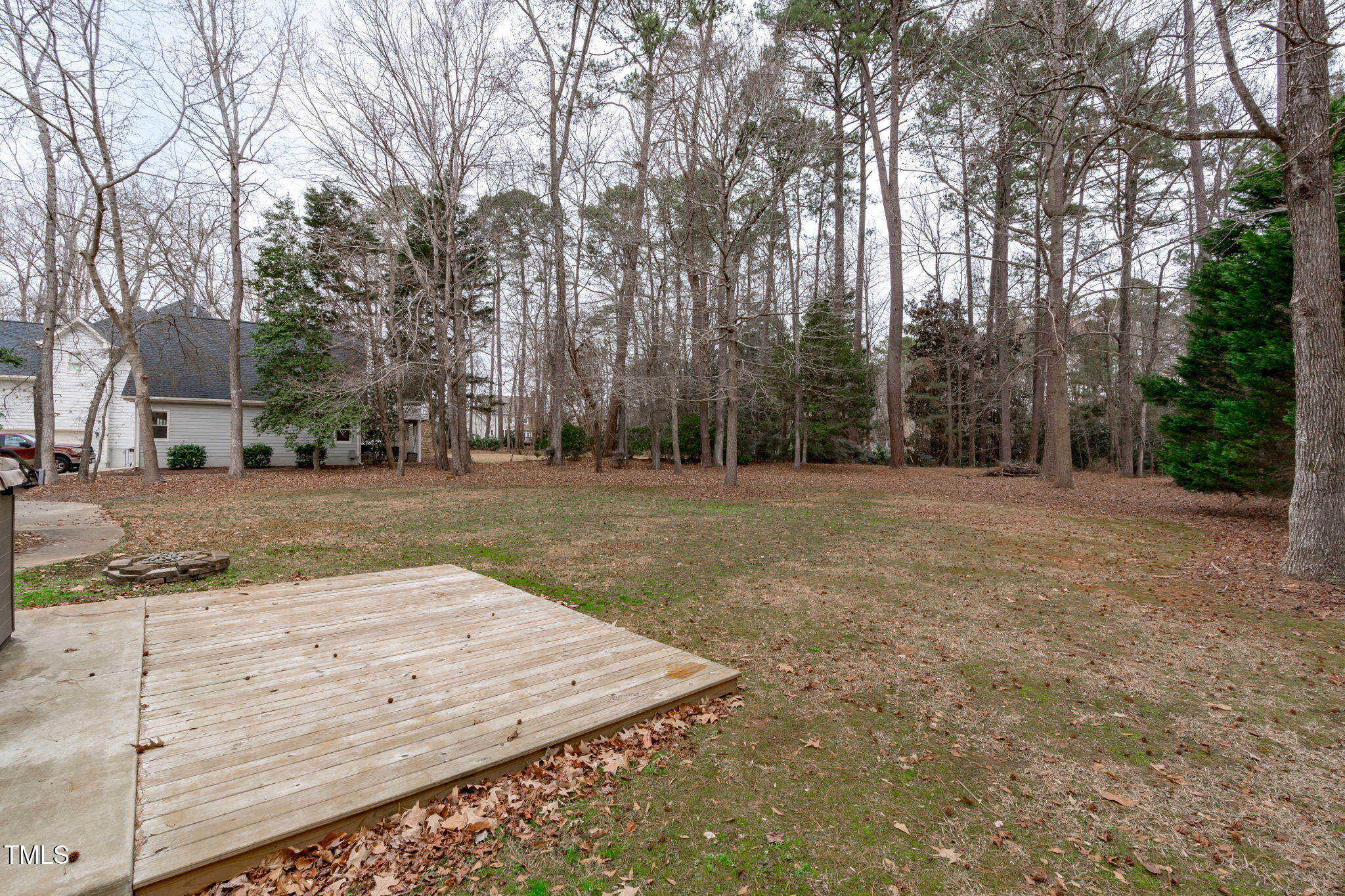6016 Heatherstone Drive Raleigh, NC 27606 - Photo 33 of 40 a view of a backyard with large trees