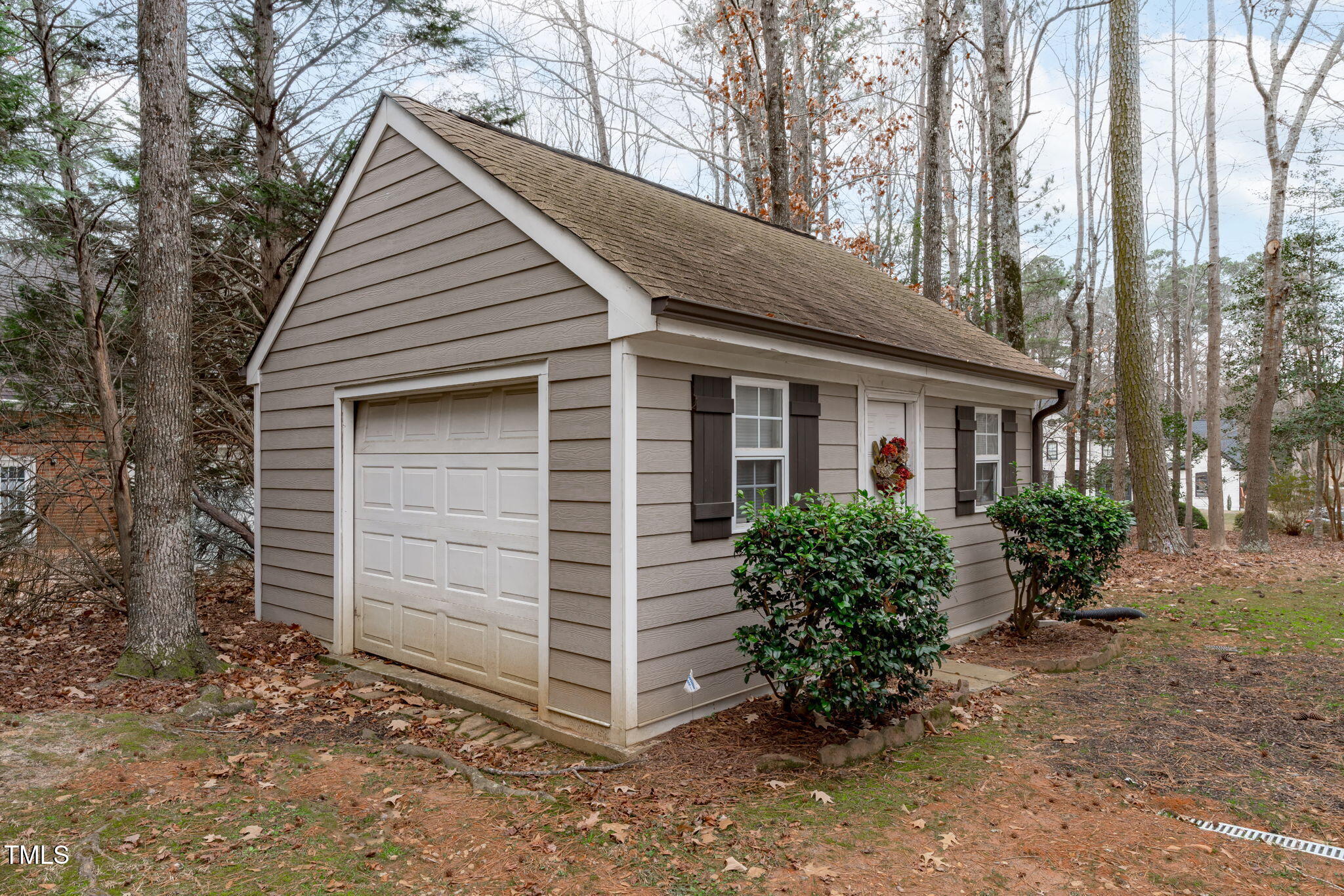 6016 Heatherstone Drive Raleigh, NC 27606 - Photo 34 of 40 a view of a house with a yard