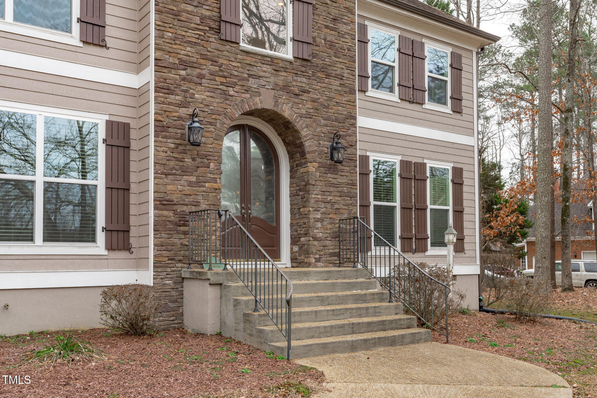 6016 Heatherstone Drive Raleigh, NC 27606 - Photo 3 of 40 a front view of a house with stairs