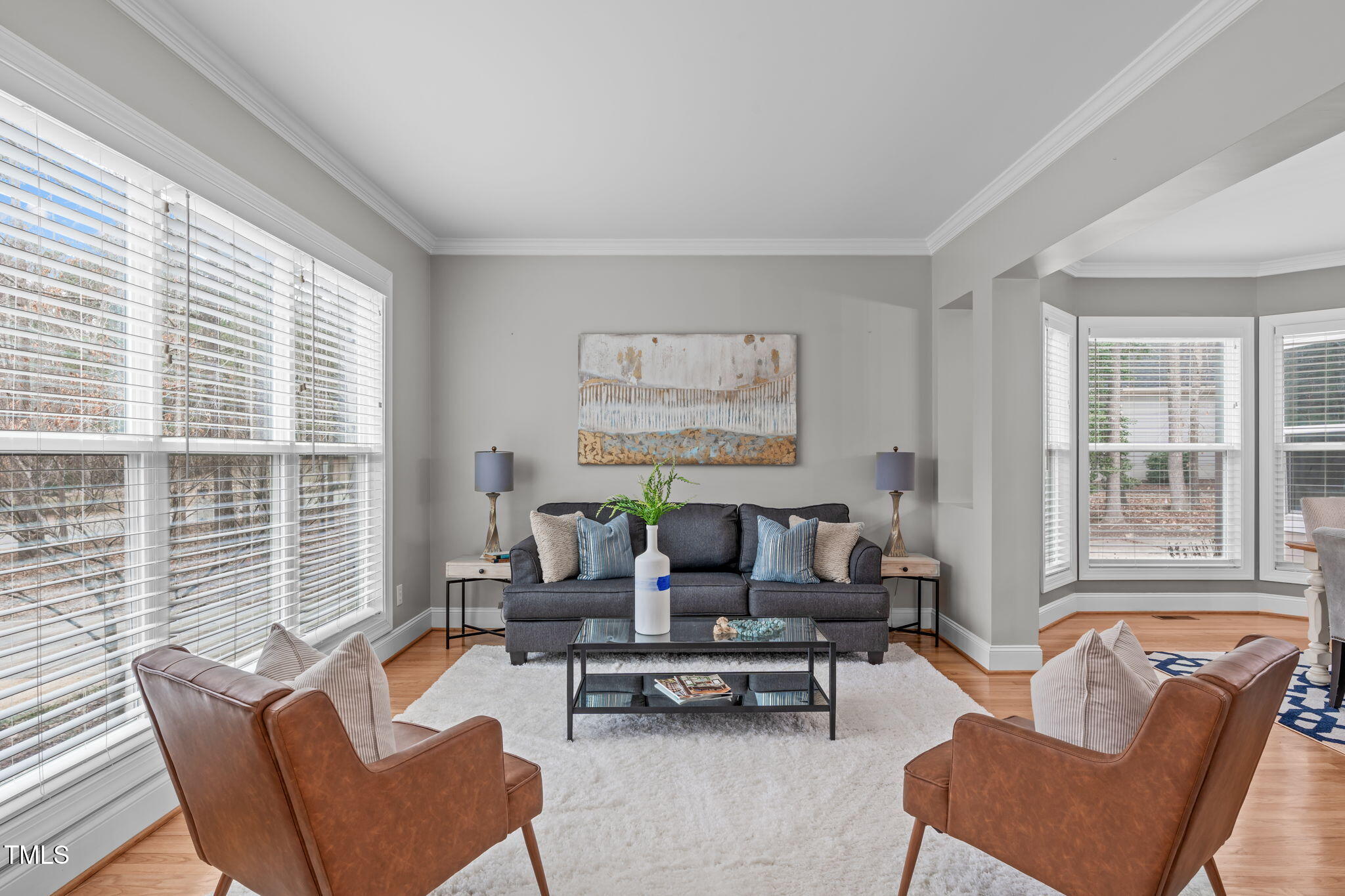 6016 Heatherstone Drive Raleigh, NC 27606 - Photo 5 of 40 a living room with furniture and a large window