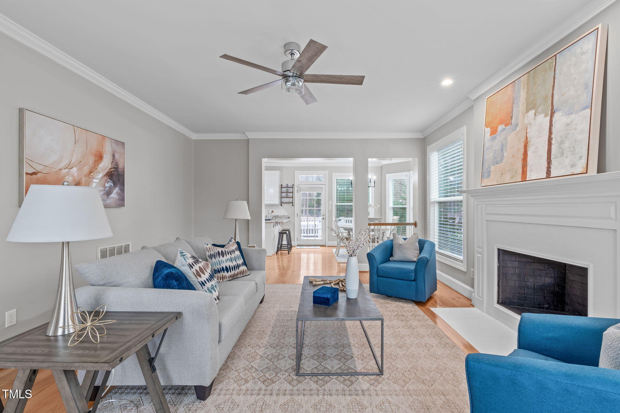 6016 Heatherstone Drive Raleigh, NC 27606 - Photo 9 of 40 a living room with furniture and a fireplace