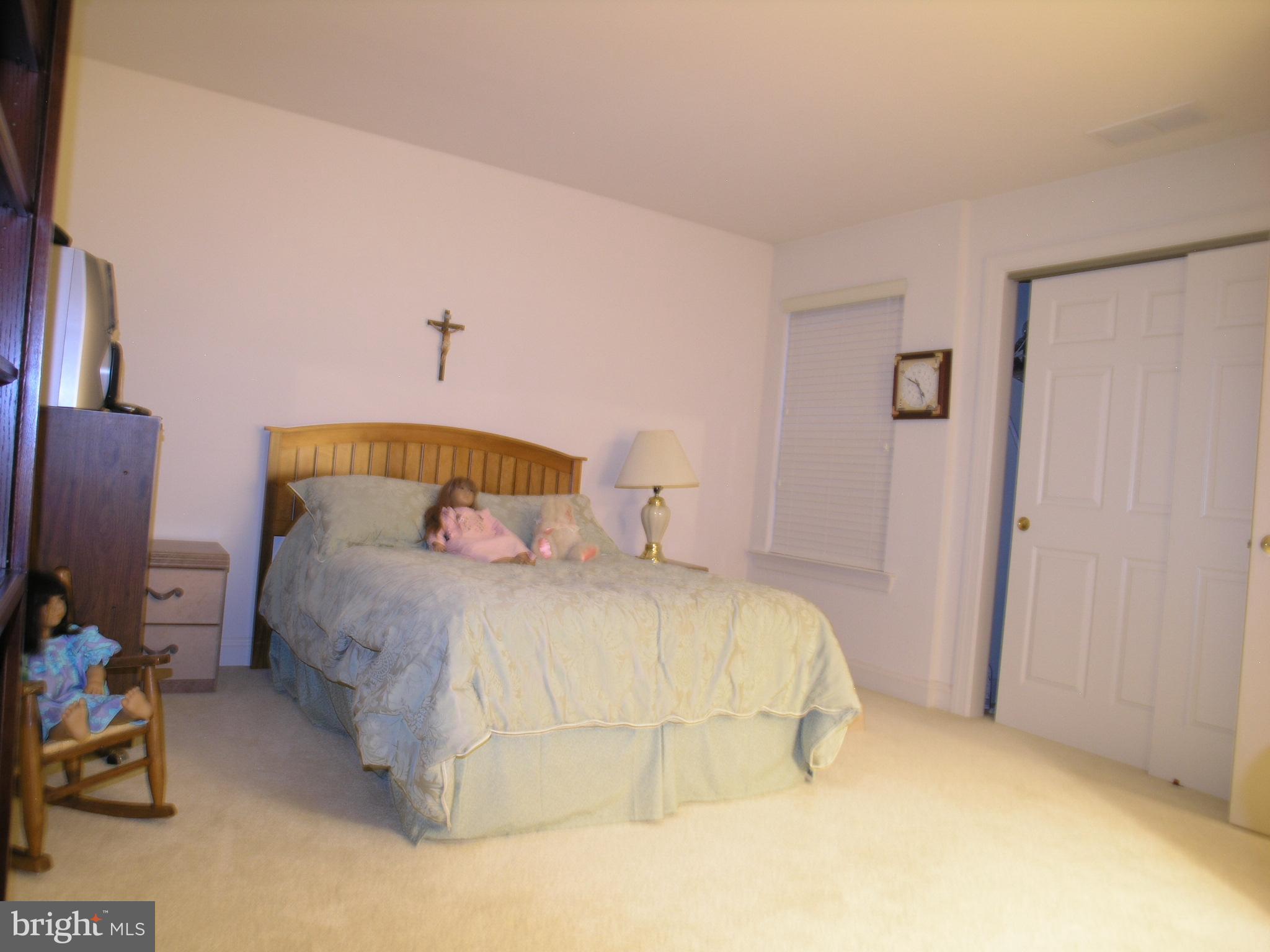 118 Casey Lane Bensalem, PA 19020 - Photo 14 of 26 a bedroom with a bed and a window