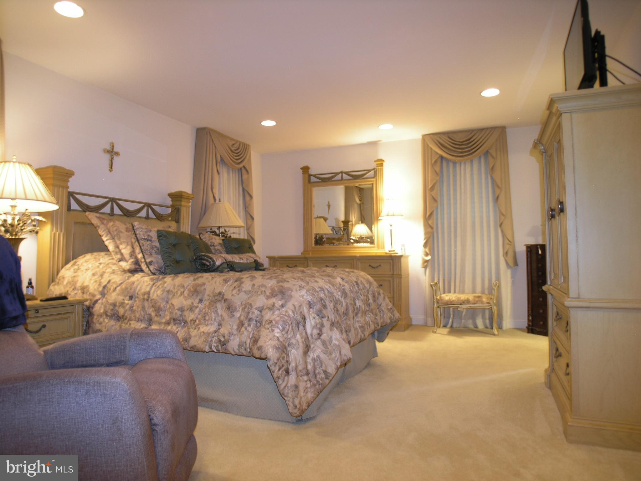 118 Casey Lane Bensalem, PA 19020 - Photo 15 of 26 a spacious bedroom with a bed and a refrigerator