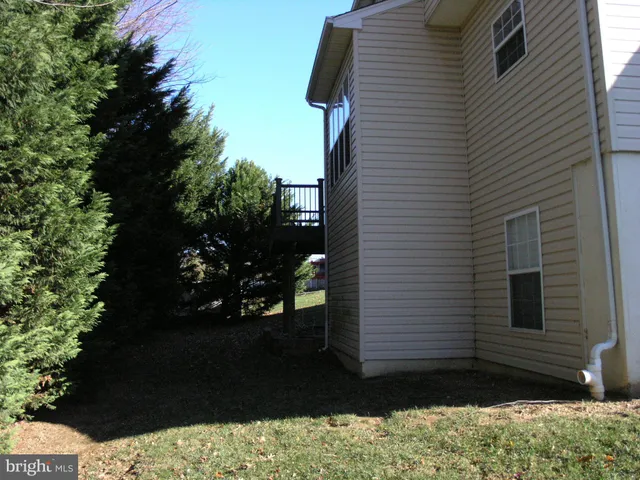 a kitchen with stainless steel appliances kitchen island granite countertop a refrigerator and a stove top oven
